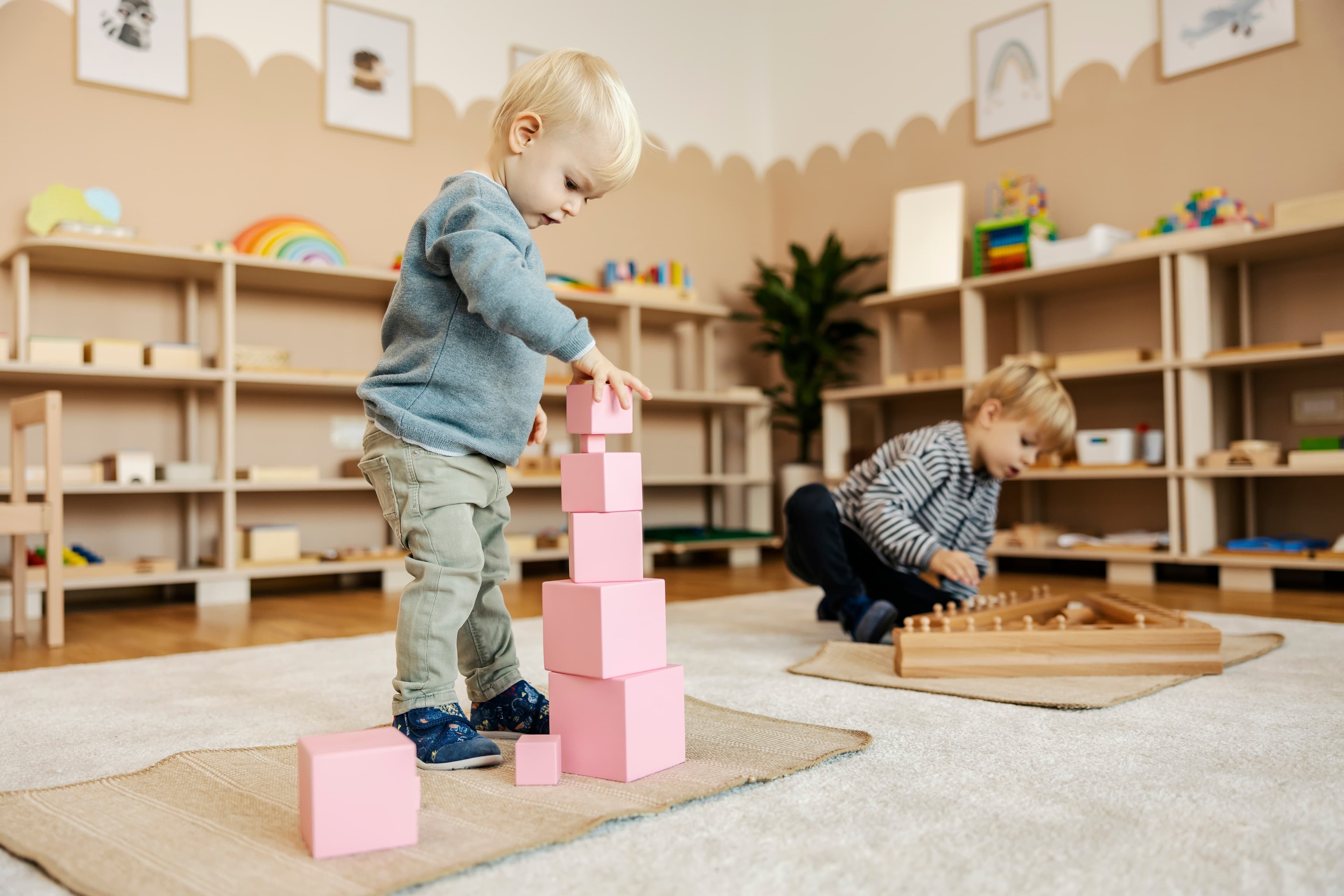 Children working with Montessori materials in a prepared classroom