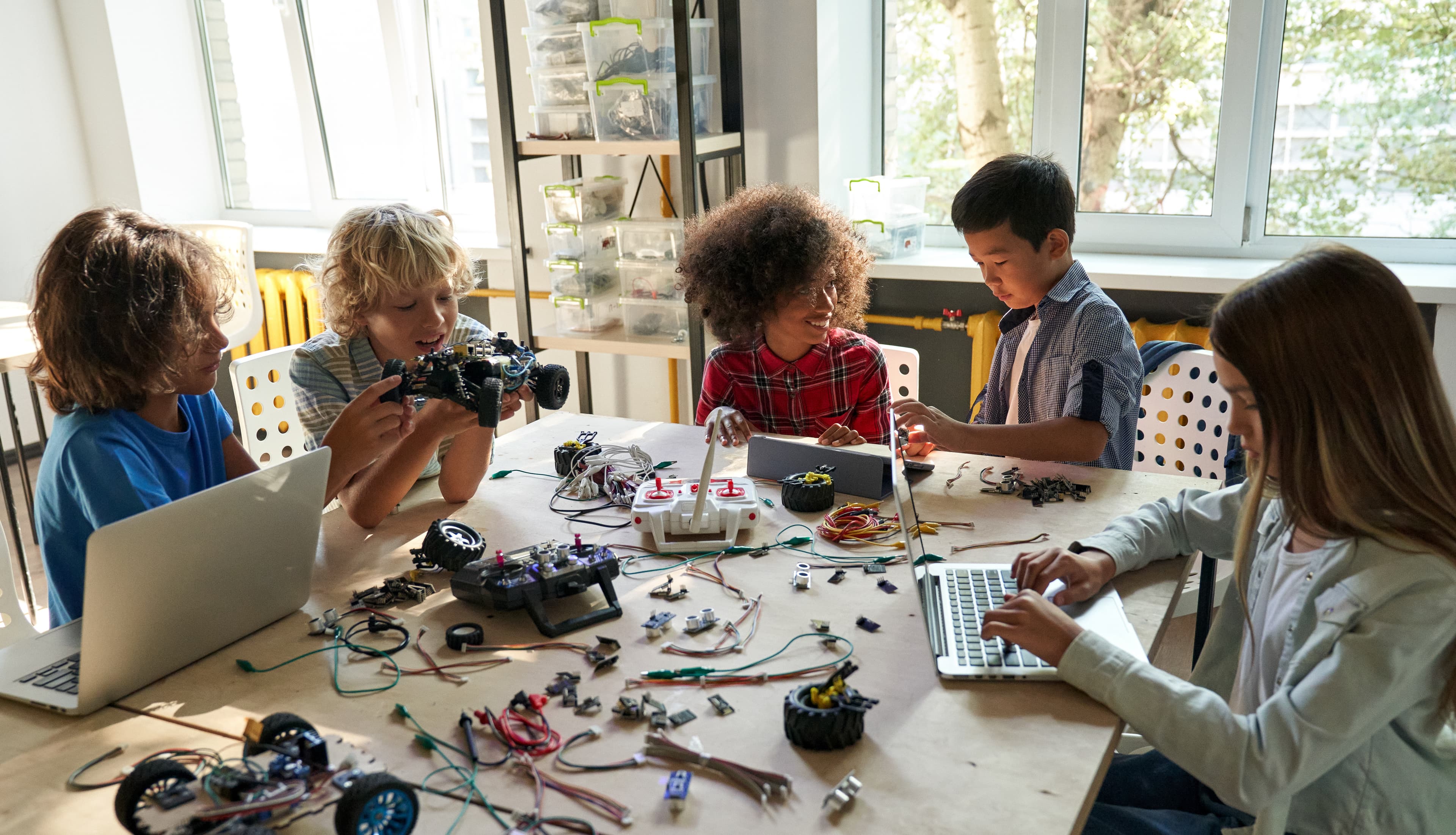 Children collaborating on hands-on robotics and engineering projects