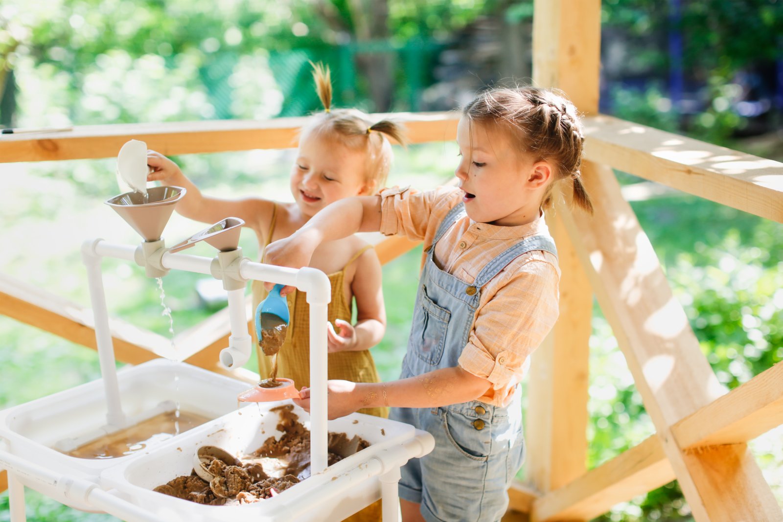 Children exploring water and sensory STEM play